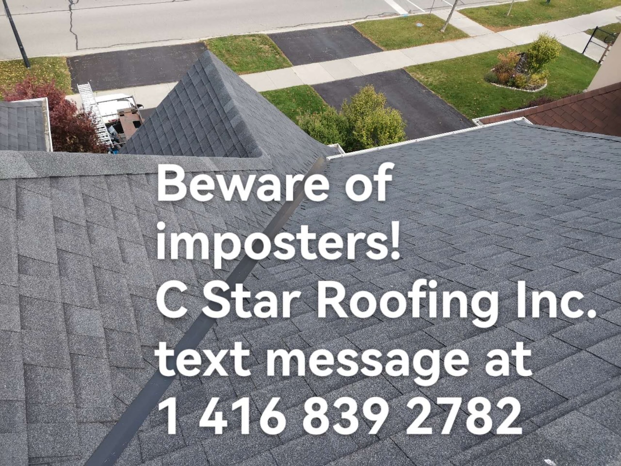 Completed grey shingle roof with a finished valley on a residential home